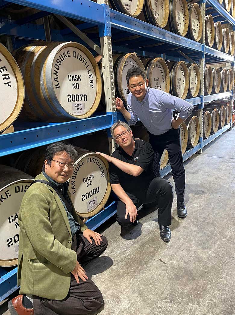 Three people in the aging warehouse.  From the left, Hideo Yamaoka, Stephen Van Aiken, and Kosho Brewery President Yoshitsugu Komasa.